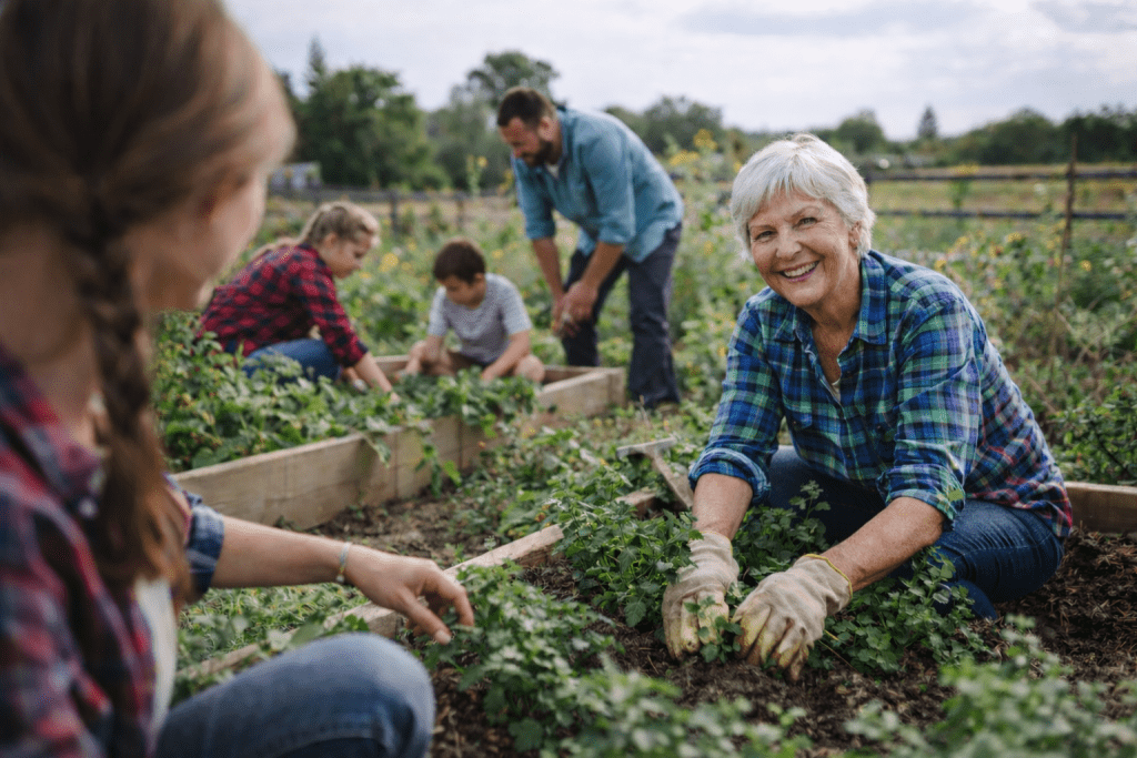 Volunteers of different ages working together in a community garden